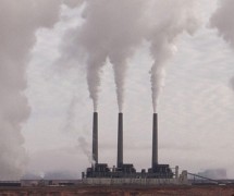 three smokestacks with billowing gases